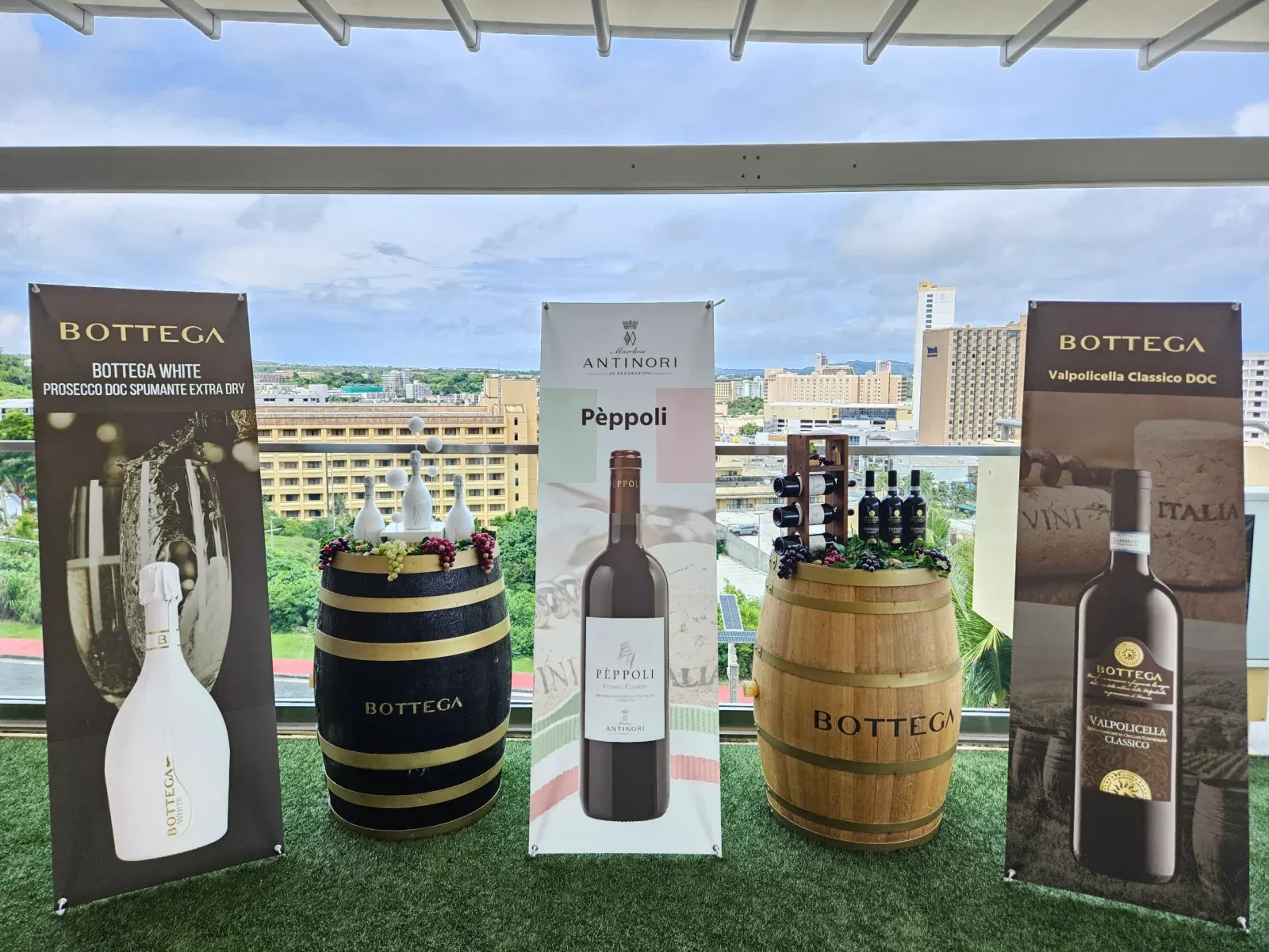 A Bottega and Peppoli display with wine barrels on The Sky Rooftop
