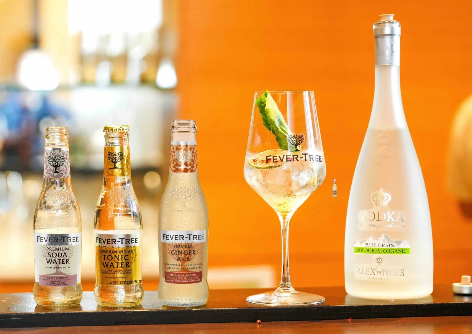 Fever-Tree soda water, tonic and ginger ale beside a gin and tonic